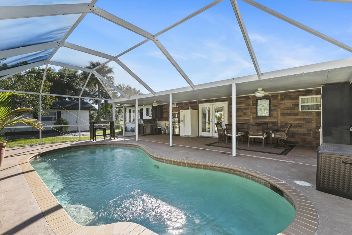 640 27th Street Southwest Naples, FL 34117 - Photo 17 of 37 a swimming pool with outdoor seating and yard
