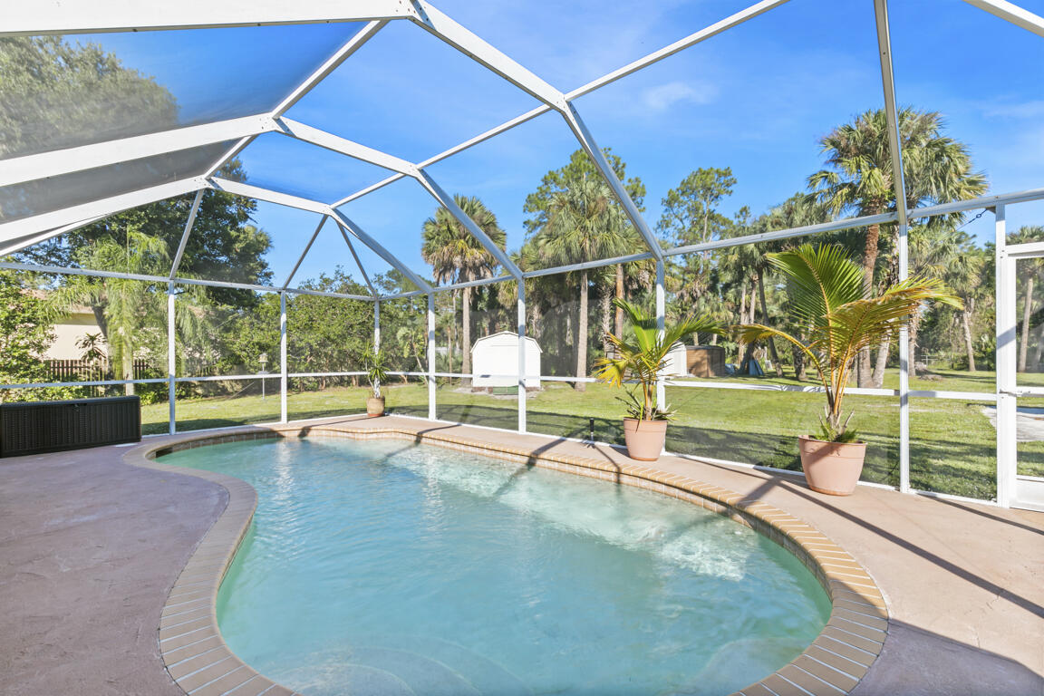 640 27th Street Southwest Naples, FL 34117 - Photo 19 of 37 swimming pool view with a garden space
