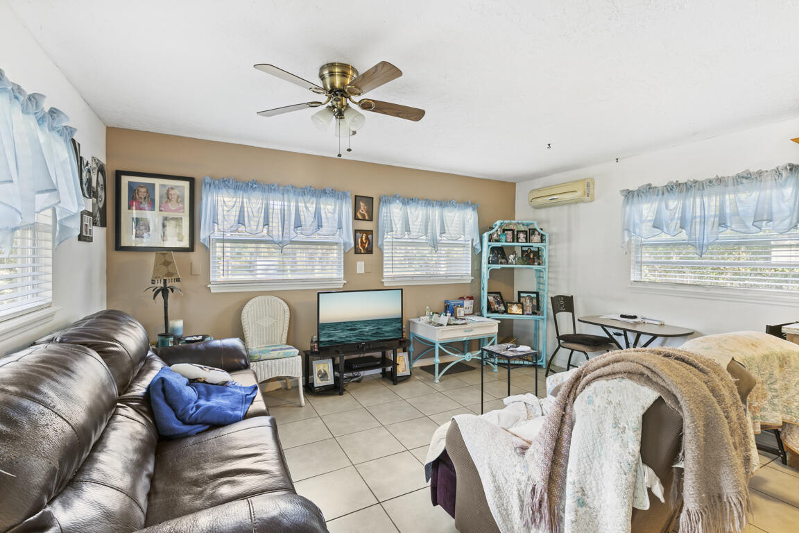 640 27th Street Southwest Naples, FL 34117 - Photo 25 of 37 a living room with furniture and a large window