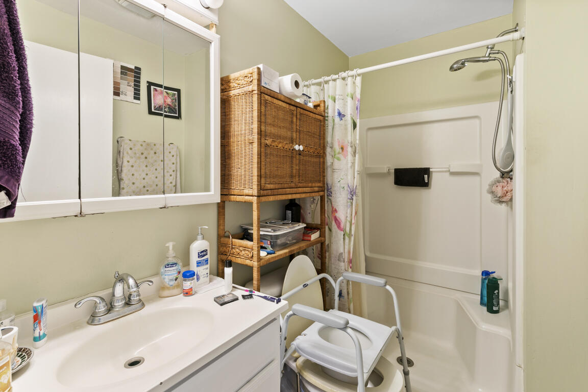 640 27th Street Southwest Naples, FL 34117 - Photo 28 of 37 a bathroom with a sink and a mirror