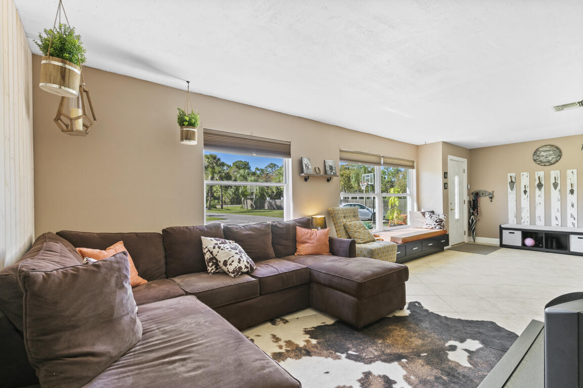 640 27th Street Southwest Naples, FL 34117 - Photo 4 of 37 a living room with furniture and a window