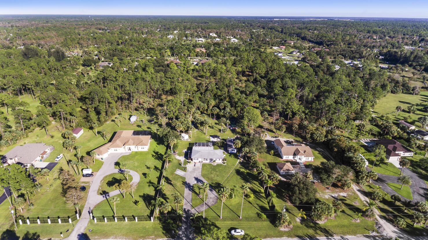 640 27th Street Southwest Naples, FL 34117 - Photo 32 of 37 an aerial view of a houses with a yard