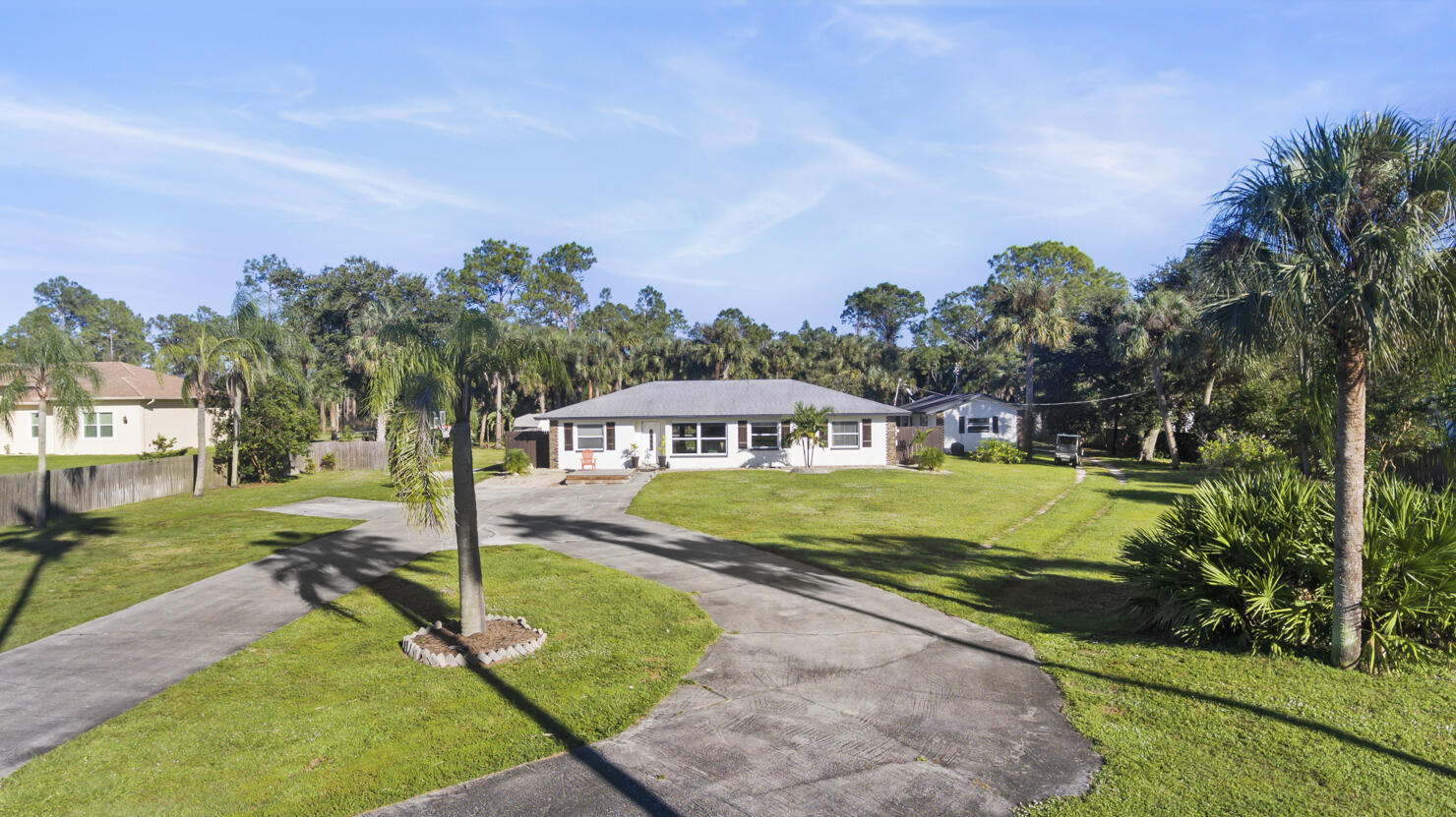640 27th Street Southwest Naples, FL 34117 - Photo 37 of 37 a front view of a house with garden