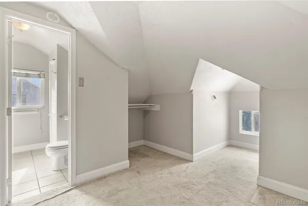 a bathroom with a sink mirror and a shower