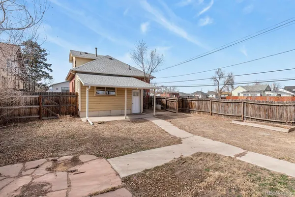 a view of a house with a back yard