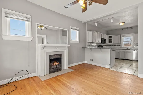 a view of a kitchen with a stove cabinets and a fireplace