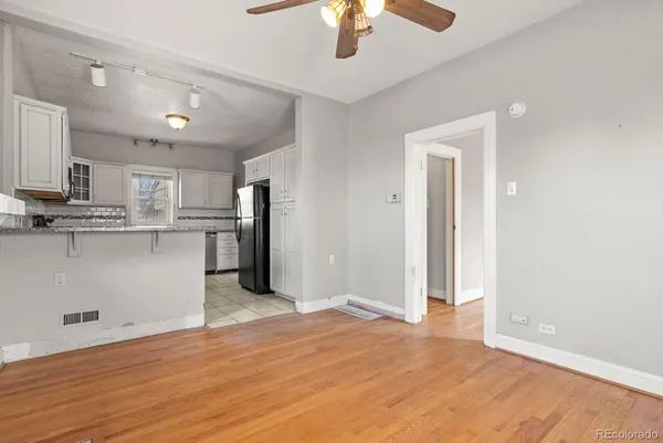 a view of kitchen with wooden floor