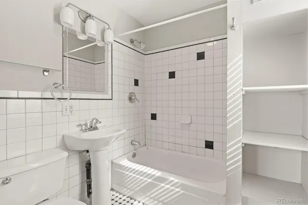 a bathroom with a bathtub and shower