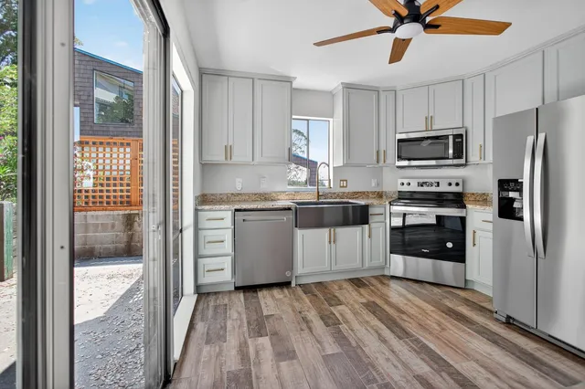 a kitchen with sink and window