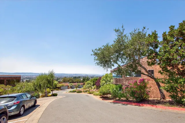 a picture of car parked on the side of a street