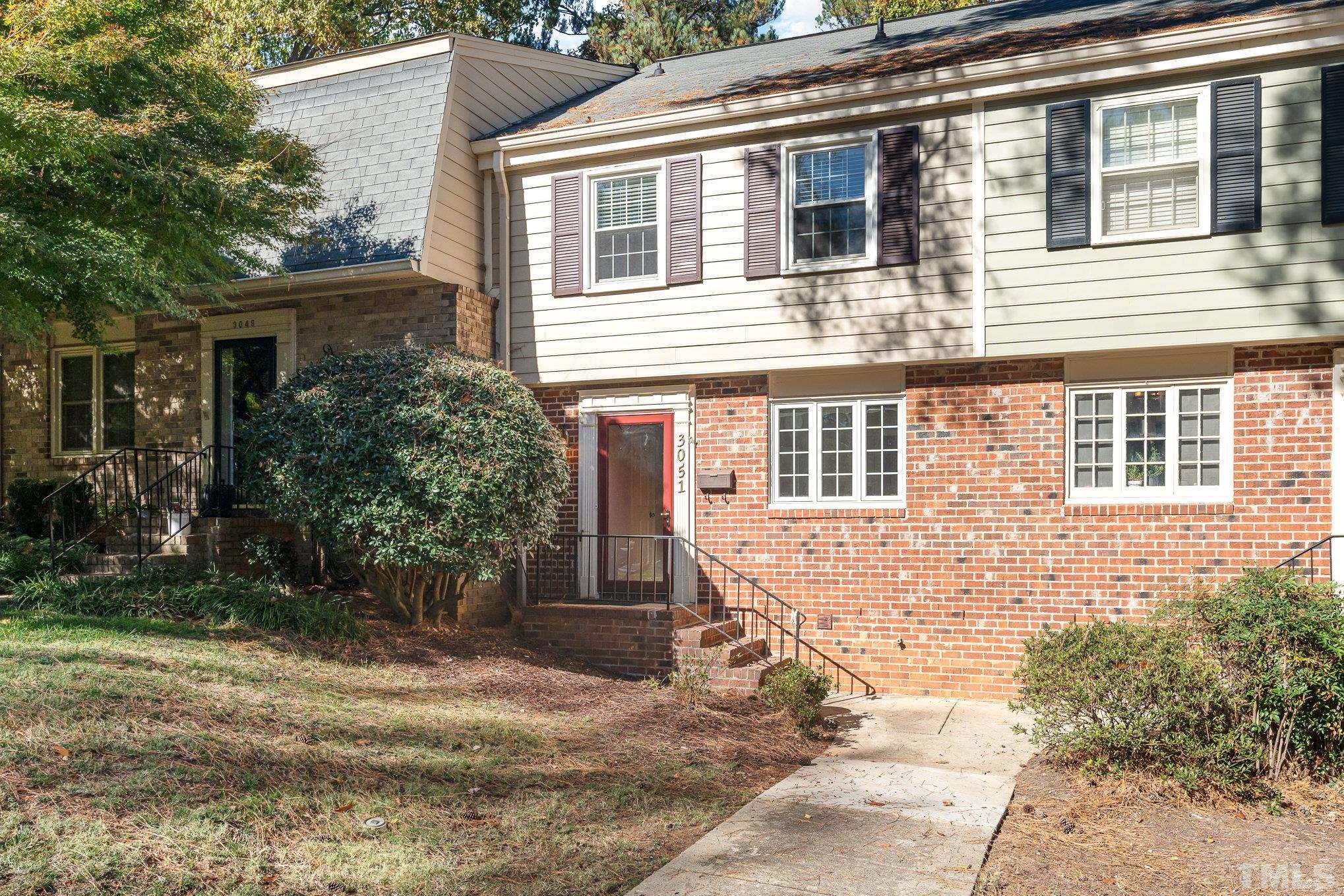 3051 Wycliff Road Raleigh, NC 27607 - Photo 1 of 18 a front view of a house with garden