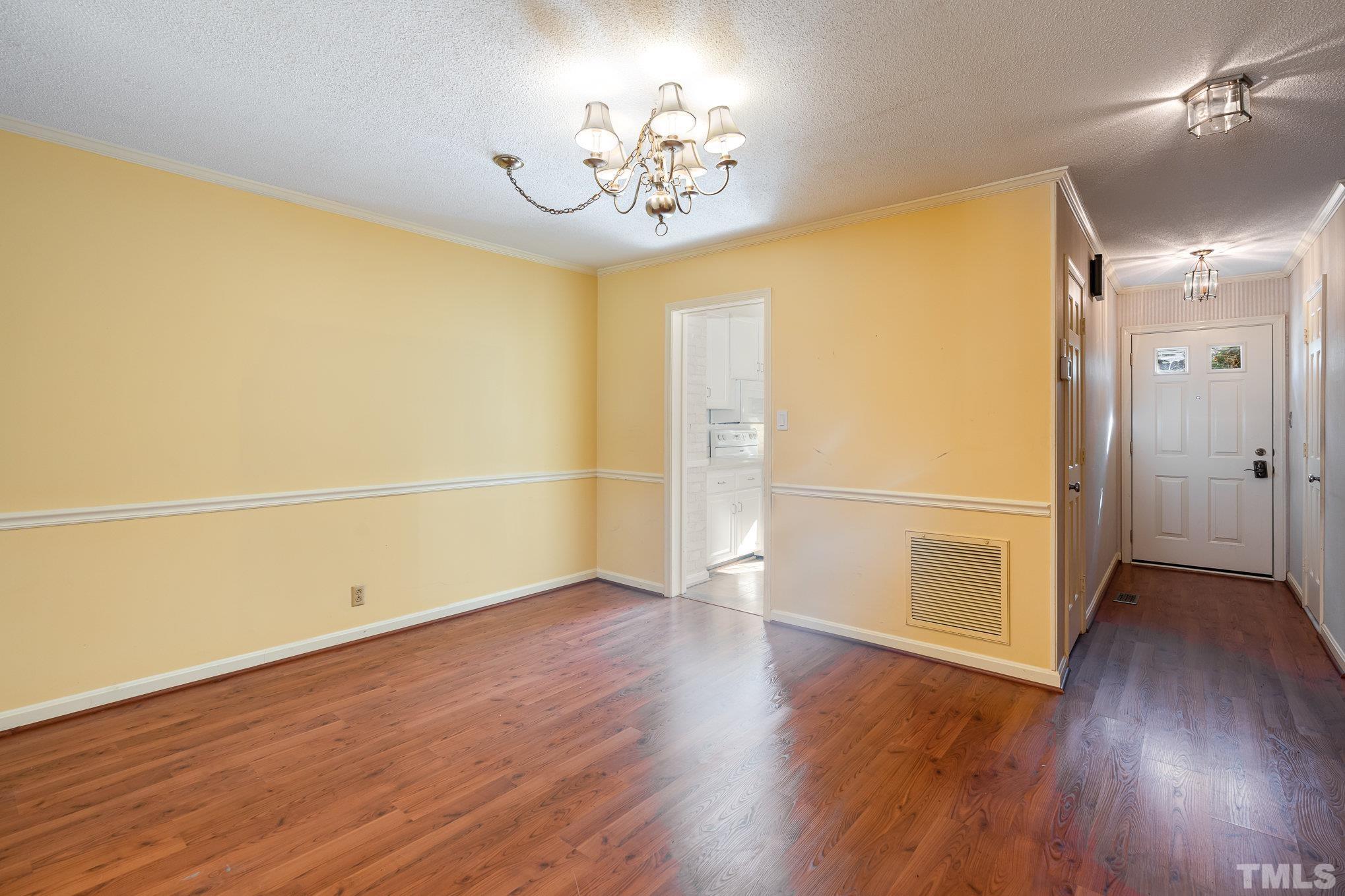 3051 Wycliff Road Raleigh, NC 27607 - Photo 5 of 18 wooden floor in an empty room with a window