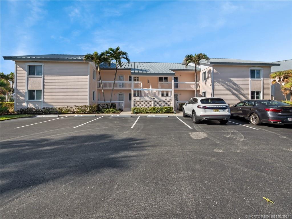 484 Northeast Plantation Road, Unit 4106 Jensen Beach, FL 34957 - Photo 13 of 15 a car parked in front of a house