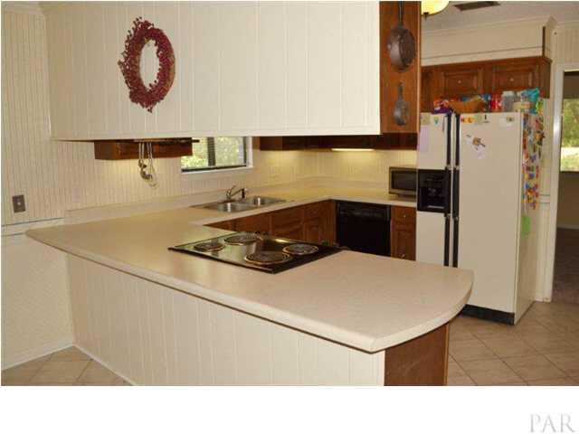 8801 Burning Tree Road Pensacola, FL 32514 - Photo 11 of 24 complete with breakfast bar.