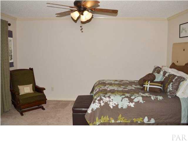 8801 Burning Tree Road Pensacola, FL 32514 - Photo 14 of 24 attractive ceiling fan and crown moldings.