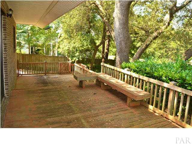 8801 Burning Tree Road Pensacola, FL 32514 - Photo 19 of 24 It is multi-level with built in seating and stairs to the backyard.