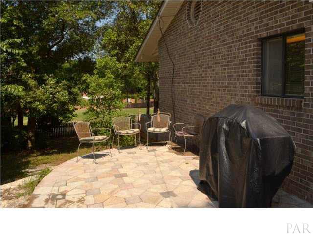 8801 Burning Tree Road Pensacola, FL 32514 - Photo 23 of 24 There is also an open patio with access from the kitchen & laundry rooms. This decorative patio is crafted with mosaic concrete tiles in a custom pattern.
