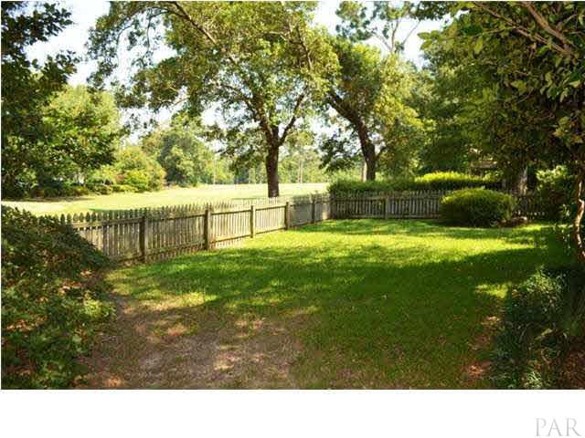 The back yard is infinitely expanded with panoramic views of the golf course.