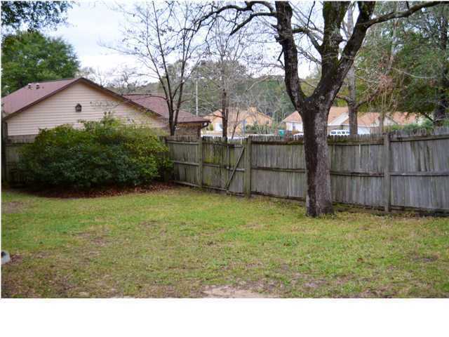 216 Ridge Lake Road Crestview, FL 32536 - Photo 2 of 12 a black and white photo of a garden