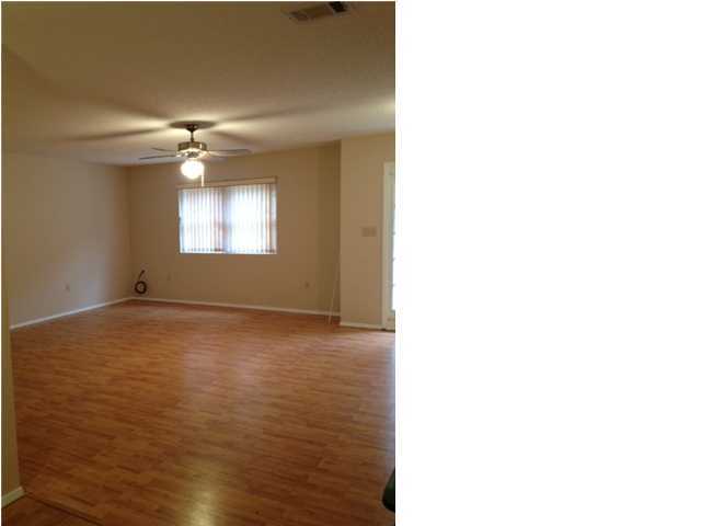 216 Ridge Lake Road Crestview, FL 32536 - Photo 7 of 12 a view of an empty room with window and chandelier fan