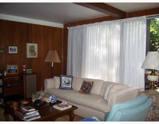 227 Woodcroft Road Economy, PA 15005 - Photo 8 of 12 Living Room. The 12x24 living room has vaulted ceilings and large windows and sliding glass doors to let in the natural light.