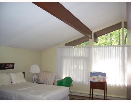 227 Woodcroft Road Economy, PA 15005 - Photo 9 of 12 Master Bedroom. The master bedroom is 16x12 and features vaulted ceiling with beams.