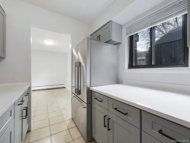 a stove top oven sitting inside of a kitchen