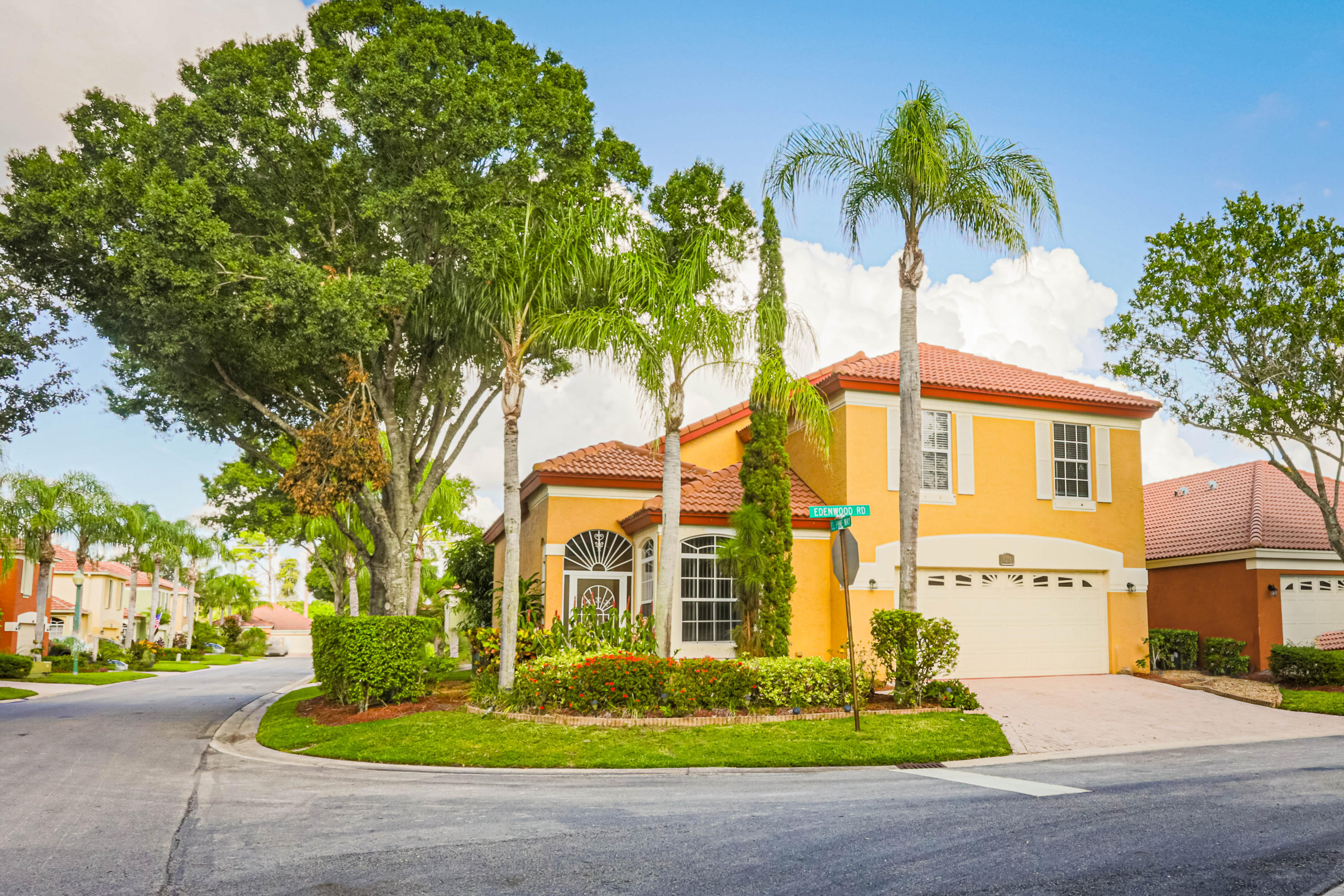 5218 Edenwood Road Riviera Beach, FL 33418 - Photo 1 of 31 a front view of a house with garden