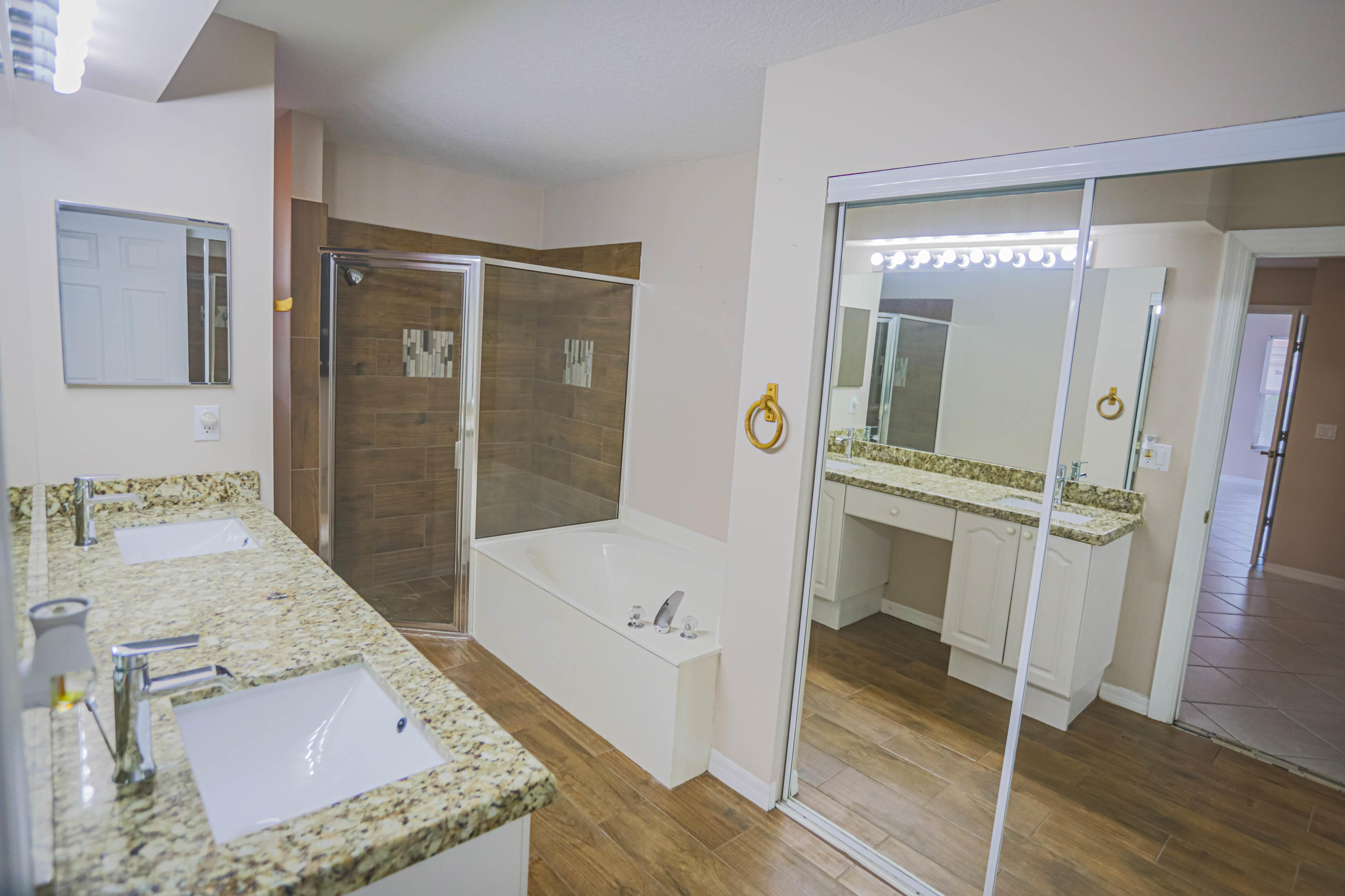 5218 Edenwood Road Riviera Beach, FL 33418 - Photo 9 of 31 a bathroom with a tub shower and sink
