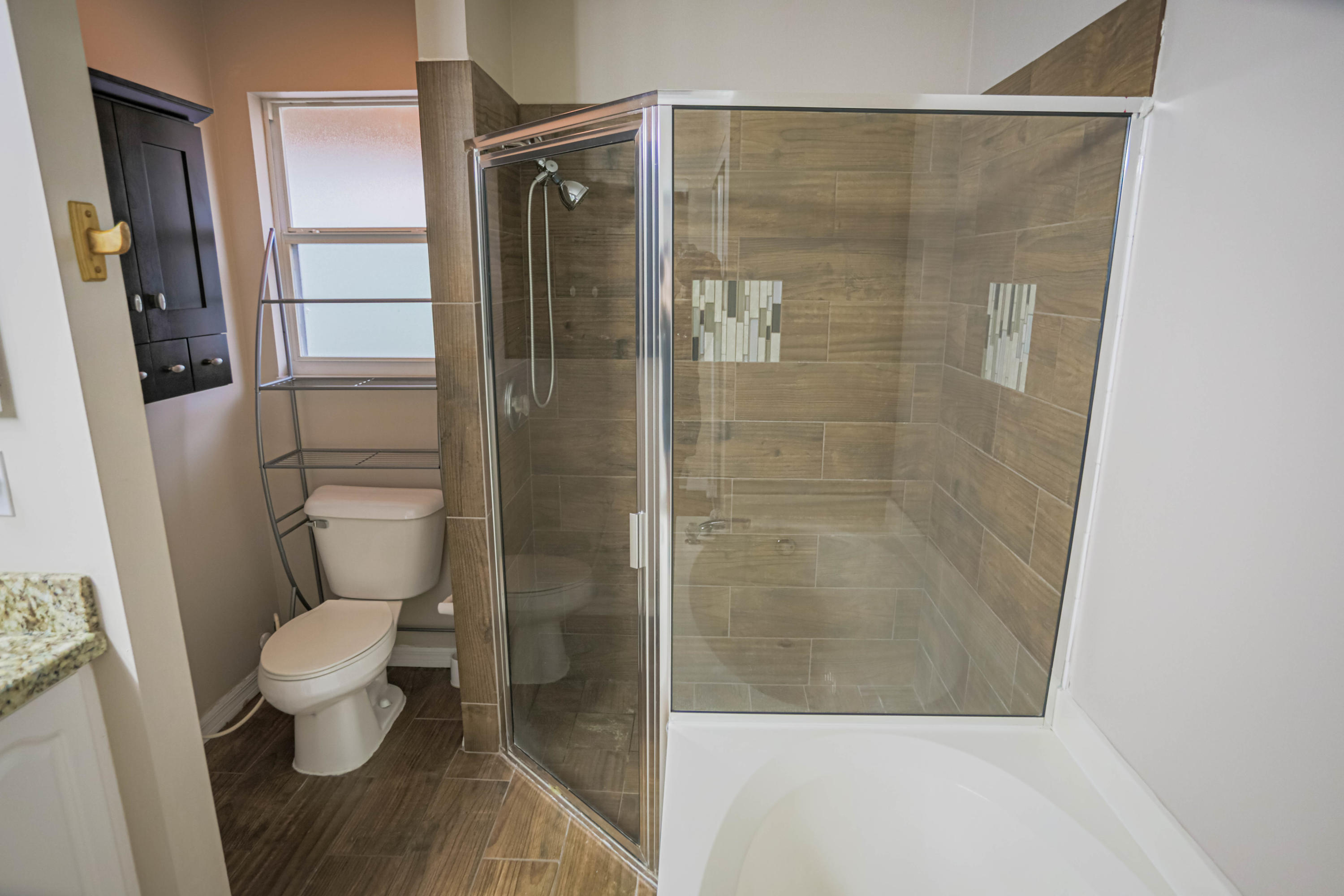 5218 Edenwood Road Riviera Beach, FL 33418 - Photo 10 of 31 a bathroom with a shower and a toilet