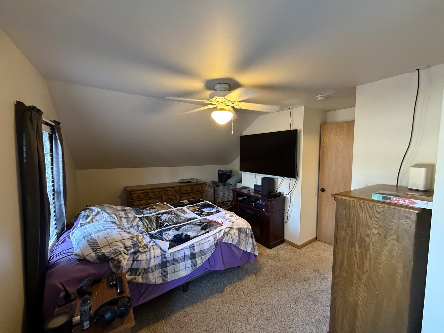 608 4th Avenue Sterling, IL 61081 - Photo 11 of 15 a bedroom with bed and a flat tv screen on the dresser