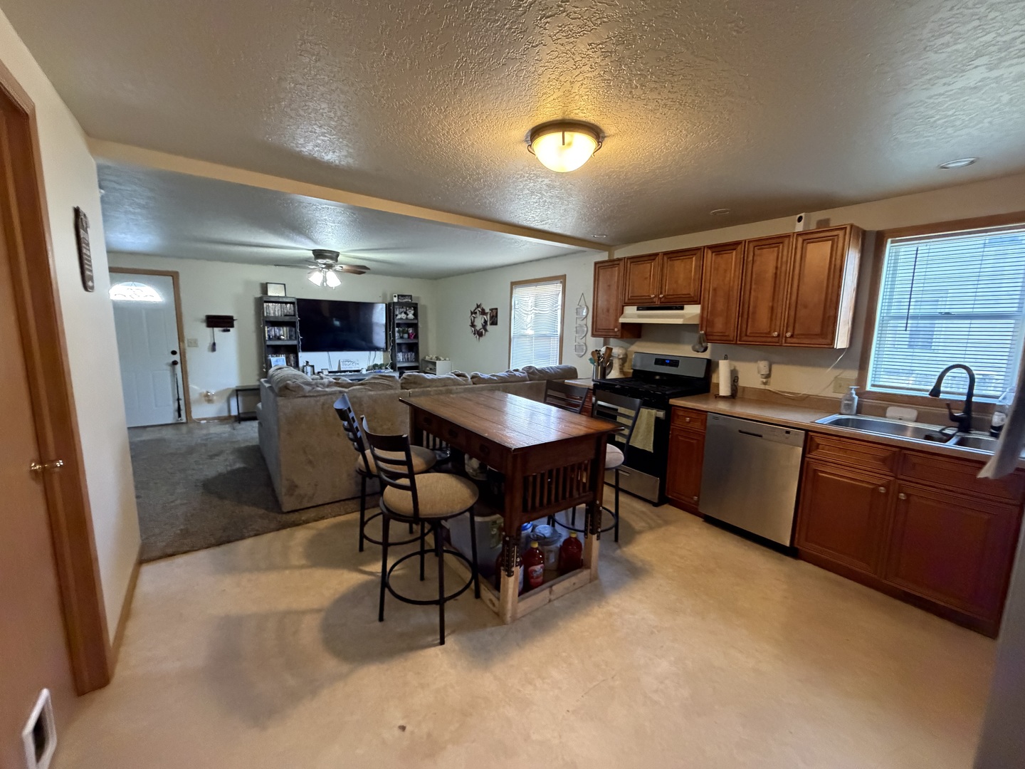 608 4th Avenue Sterling, IL 61081 - Photo 3 of 15 a kitchen with sink a microwave and cabinets