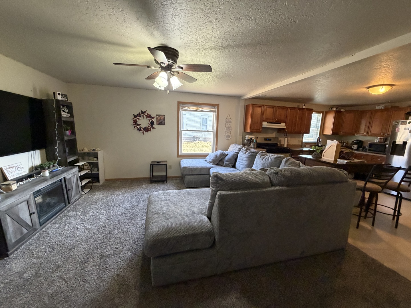 608 4th Avenue Sterling, IL 61081 - Photo 4 of 15 a living room with furniture and a flat screen tv