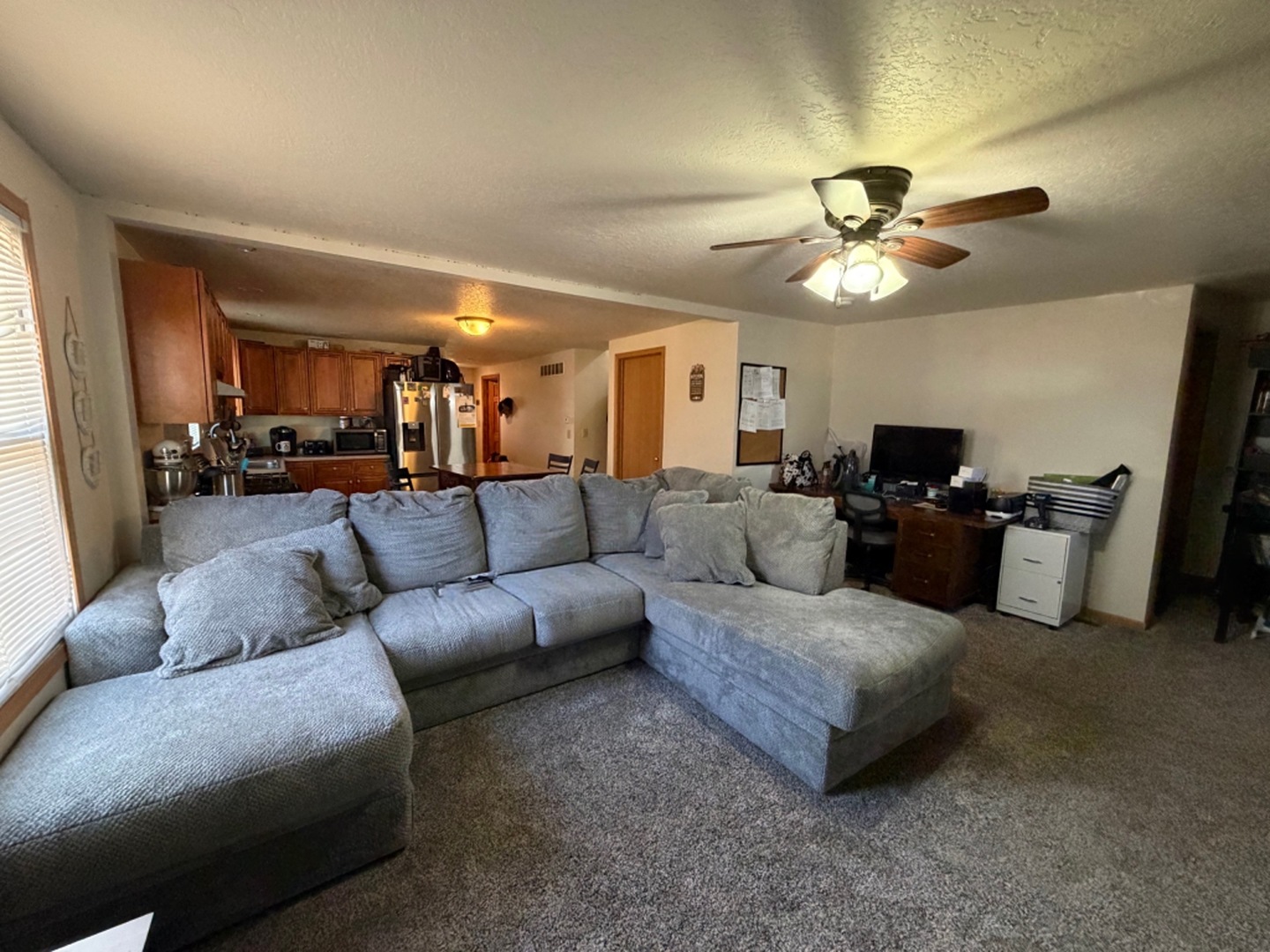 608 4th Avenue Sterling, IL 61081 - Photo 5 of 15 a living room with furniture and a ceiling fan