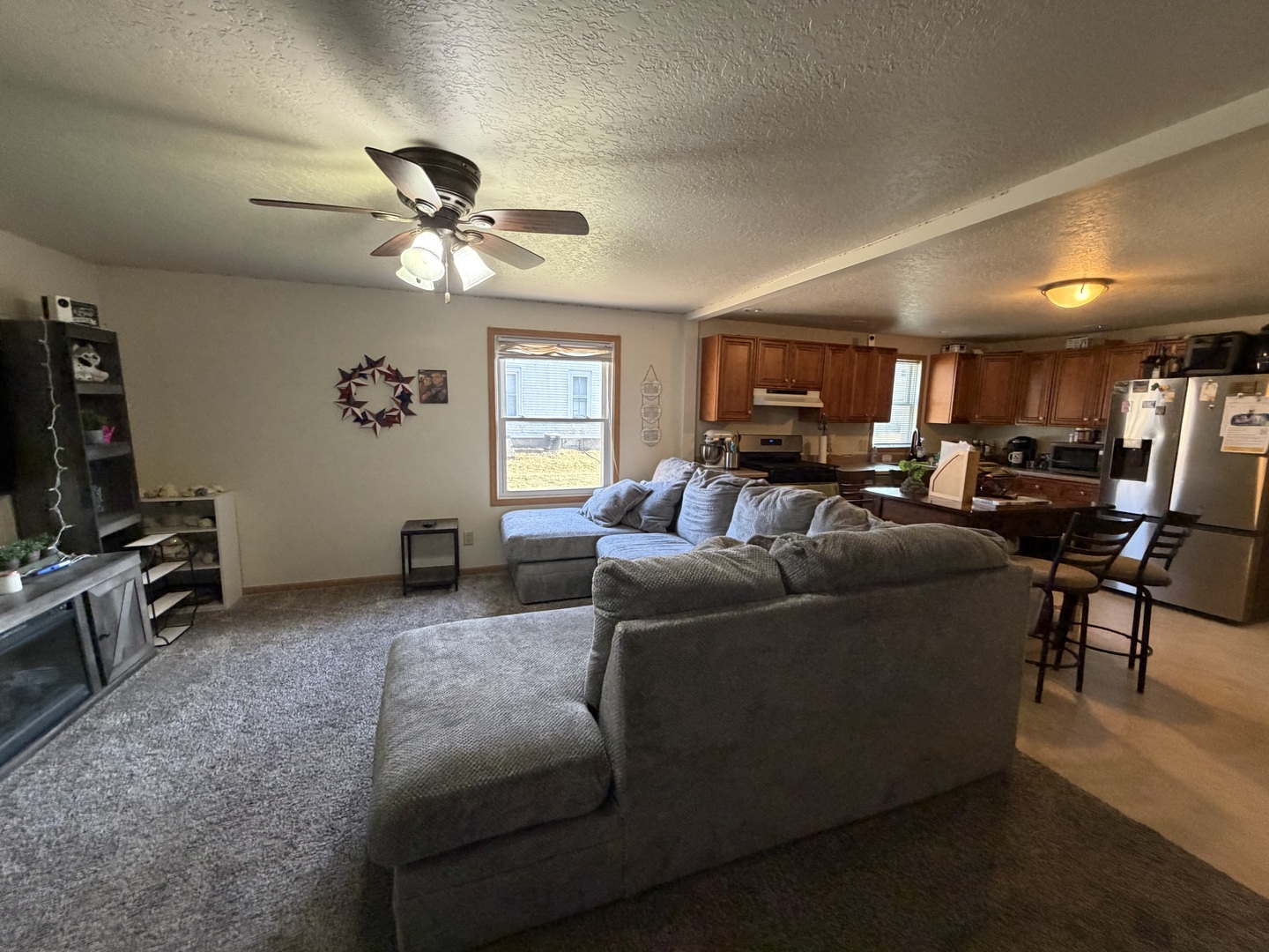 608 4th Avenue Sterling, IL 61081 - Photo 6 of 15 a living room with furniture and a flat screen tv