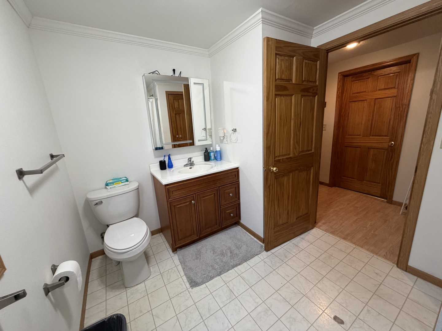 608 4th Avenue Sterling, IL 61081 - Photo 9 of 15 a bathroom with a toilet sink and mirror