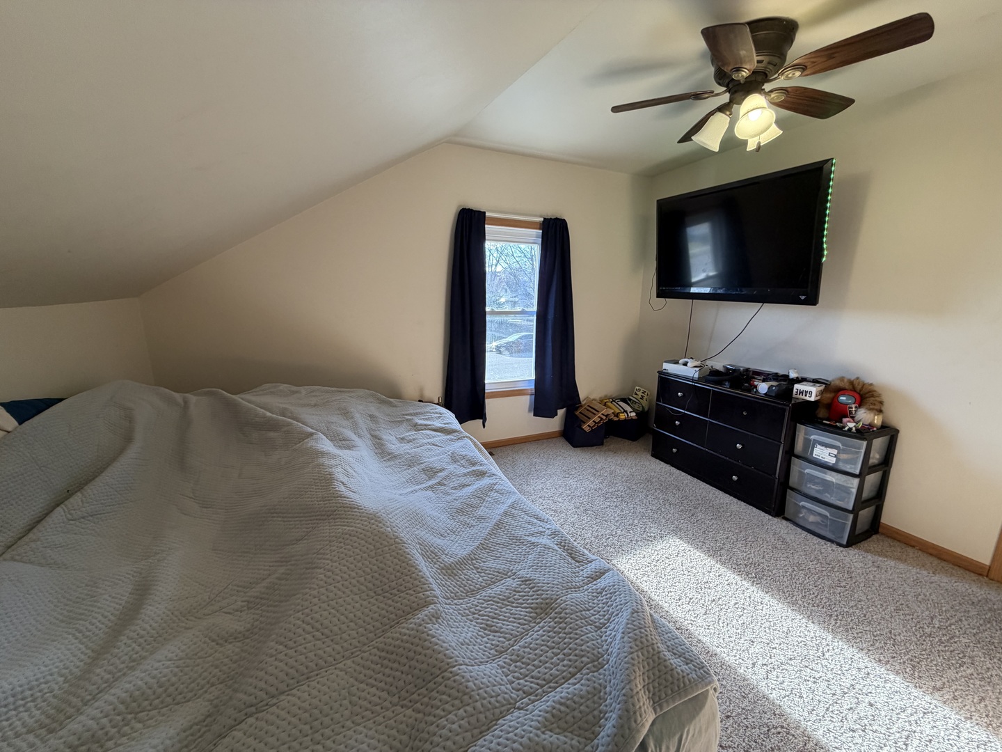 608 4th Avenue Sterling, IL 61081 - Photo 10 of 15 a bedroom with a bed and a flat screen tv