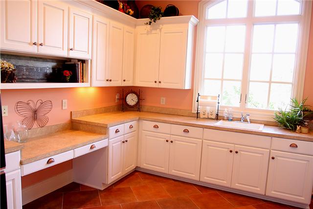 3239 Kinnard Springs Road Franklin, TN 37064 - Photo 16 of 20 Probably more storage than you've ever seen in a utility. Wall-to-wall cabinets wrap this room. Accommodates 2nd fridge. Washer/dryer. Broom closet. Dropped desk for book-keeping, sewing, etc. Built-in utility sink.