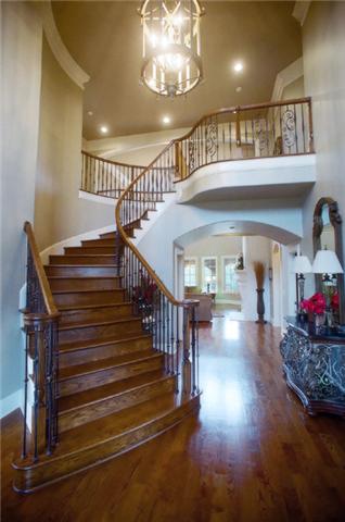 3239 Kinnard Springs Road Franklin, TN 37064 - Photo 3 of 20 Spectacular 21' tall foyer includes a custom curved grand staircase, beautiful floors, and a 5' tall chandelier (with electric lowering winch for cleaning & bulb-changes) which hangs from a faux-finished ceiling dome with custom molding.