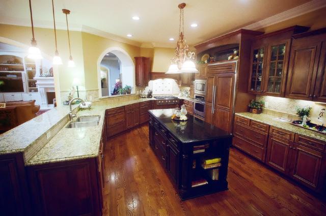 3239 Kinnard Springs Road Franklin, TN 37064 - Photo 5 of 20 A brilliant layout blends the kitchen, informal dining, and living room for efficient flow and beautiful appearance. Kitchen includes storage galore, granite tops, 6-burner range, high-end appliances, and gorgeous lighting.