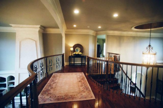 3239 Kinnard Springs Road Franklin, TN 37064 - Photo 9 of 20 The spacious balcony overlooks the living room and foyer. Custom wood railing and iron spindles outline the grand staircase and balcony for an impressive presentation.