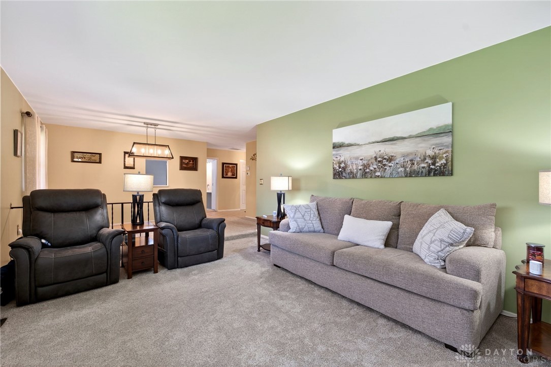 5907 Red Coach Road Dayton, OH 45429 - Photo 13 of 50 This inviting living space features comfortable carpeting and ample natural light, perfect for everyday living.