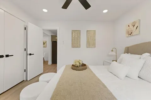a bedroom with a bed and a couch