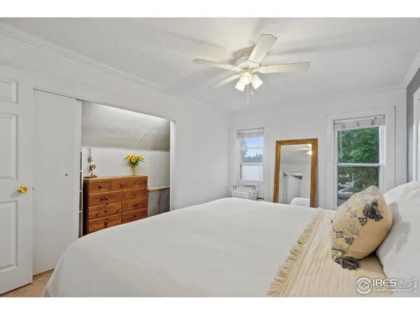 a bedroom with a bed and dresser