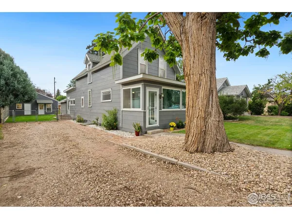 a house with trees in front of it