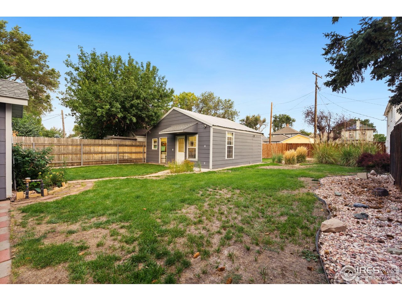 322 Maple Avenue Eaton, CO 80615 - Photo 22 of 26 a view of a house with yard and a garden