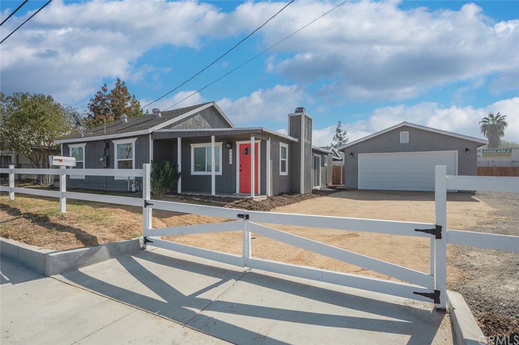 9410 Indiana Avenue Riverside, CA 92503 - Photo 1 of 1 a view of a house with swimming pool and sitting area