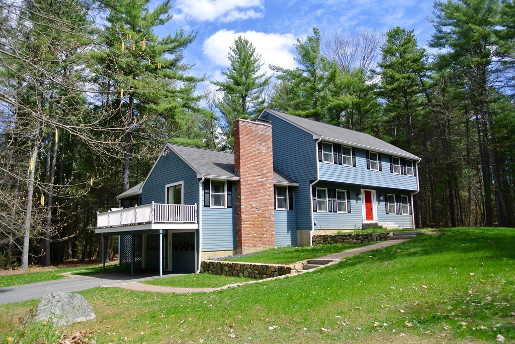 333 Littleton Road Harvard, MA 01451 - Photo 1 of 29 a view of a white house with a big yard and large trees