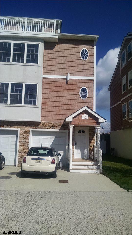 2425 Formicas Way, Unit 2425 Atlantic City, NJ 08401 - Photo 1 of 1 a front view of a house with parking space