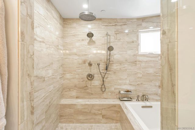 a view of a balcony with chairs and wooden floor